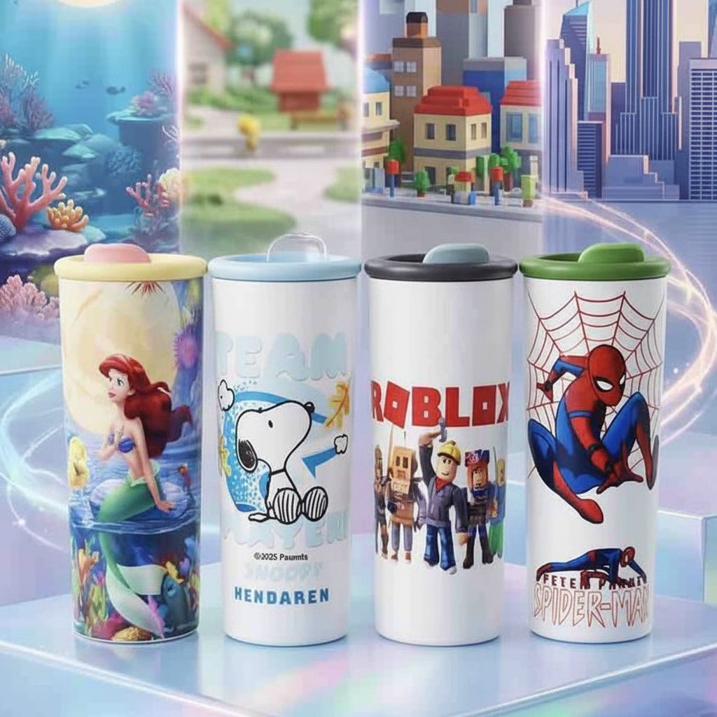 Four insulated tumblers with lids are displayed together on a glossy surface against a colorful illustrated backdrop. The tumblers feature character artwork: Ariel from The Little Mermaid, Snoopy and Pam from Peanuts, Roblox characters, and Spider-Man.
