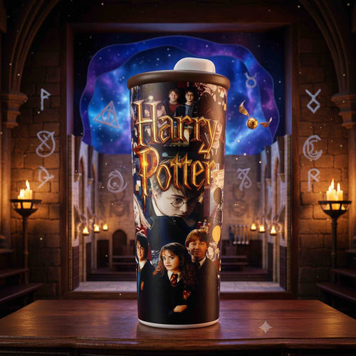 A Harry Potter themed travel tumbler with a printed design of characters and the golden 'Harry Potter' logo, displayed on a wooden surface with a magical castle and starry sky background.